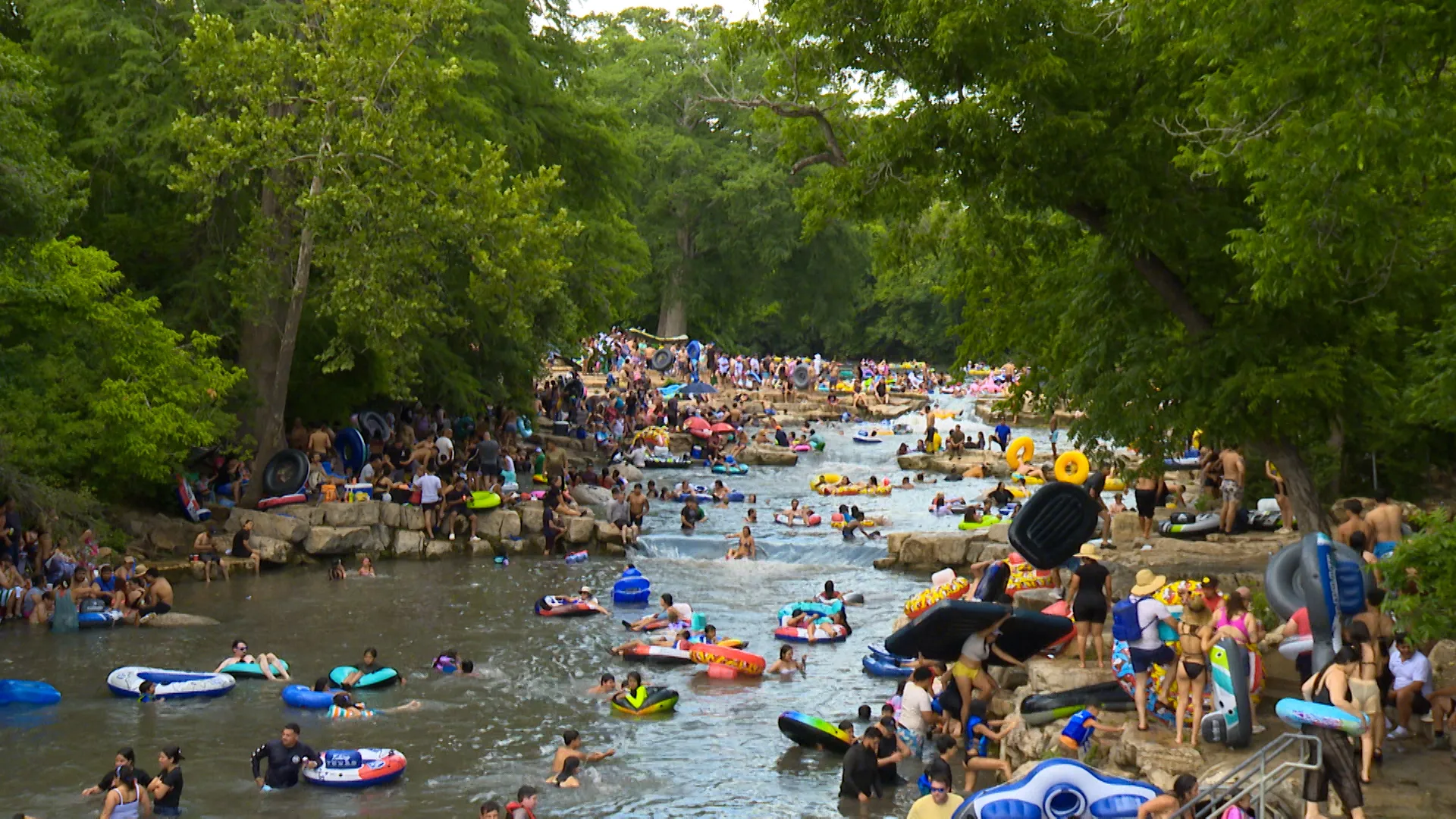 People Floating on River