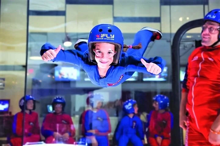 Person indoor skydiving